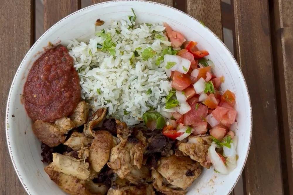 Chicken burrito bowl — cilantro-lime rice, smoky chicken, black beans, pico and blended salsa in a bowl