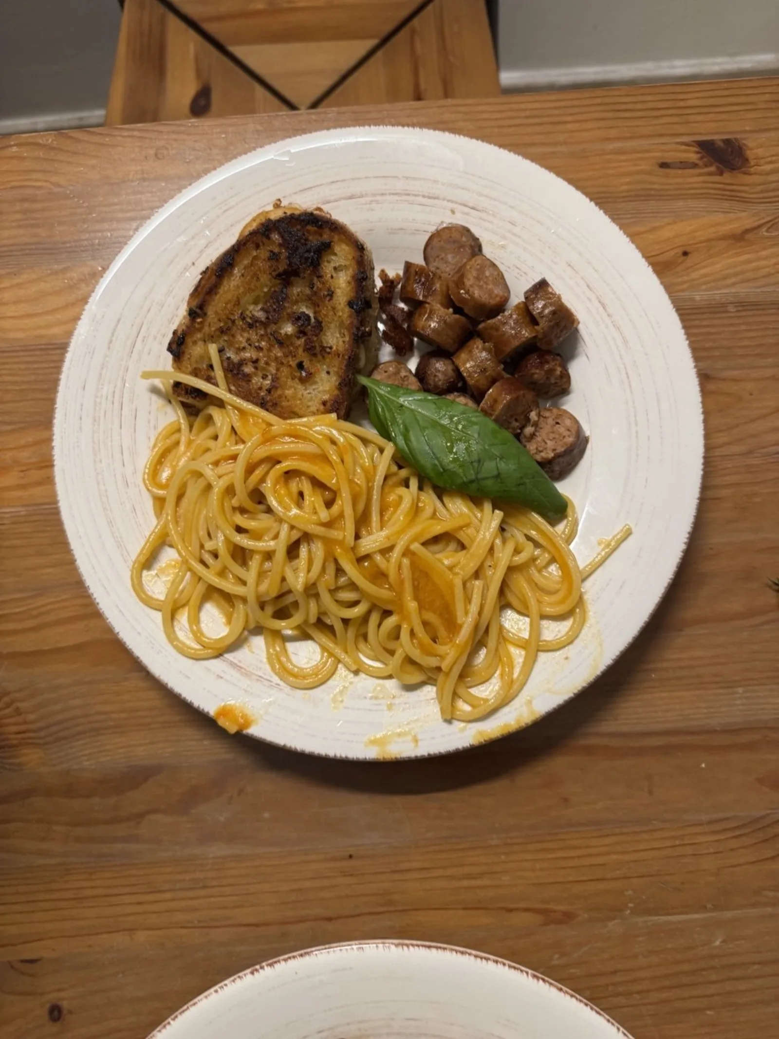 Spaghetti al Pomodoro con Salsiccia — a healthy Italian italian recipe with about 4g of fiber